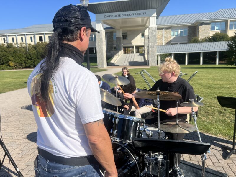 daniel de los reyes teaching a percussion student at MHS