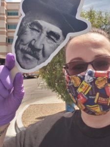 Milton Hershey School alumna, Bridget Savadge, takes a selfie in her COVID-19 mask and a cut-out of Milton Hershey.