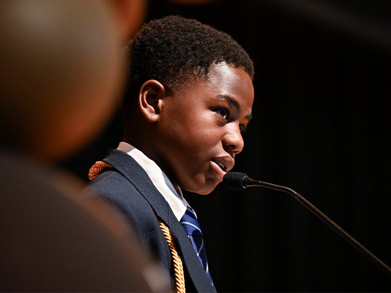 Jairus Appiah speaks at the 2024 eighth grade promotion ceremony.