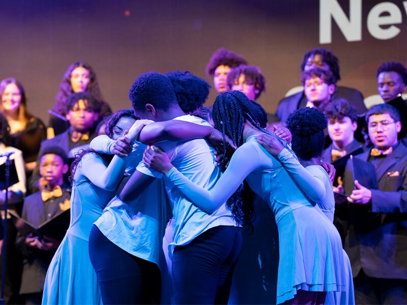 Spartan Dancers embrace during Milton Hershey School's 2024 Senior Chapel and Awards Ceremony.