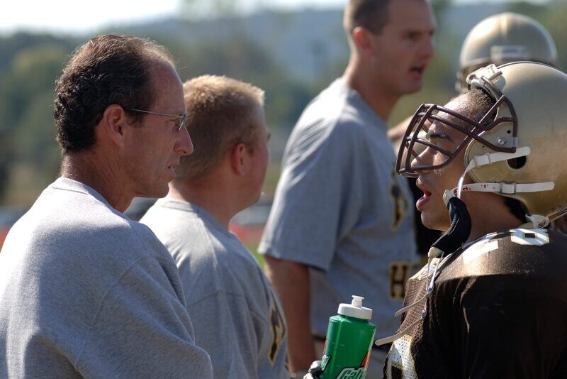 Bob Guyer talks to a member of the MHS football team.