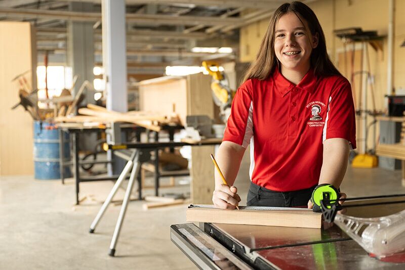 High school student in carpentry class