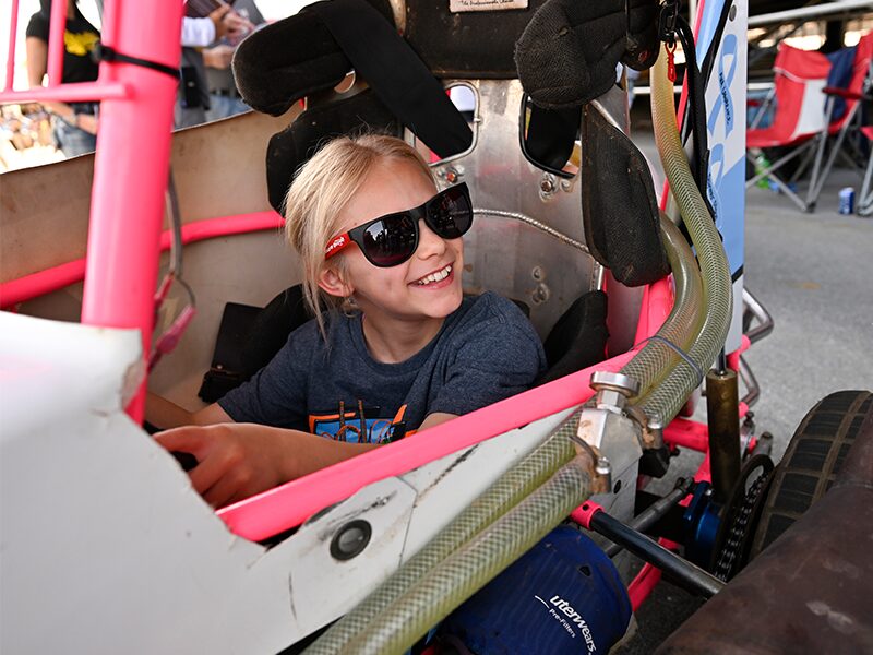 A student smiles during the Hershey Sprint Car Experience.