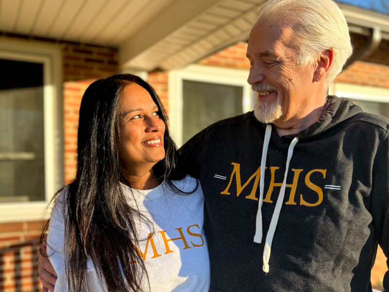 Milton Hershey School houseparents Brian and Deepa Black outside of student home