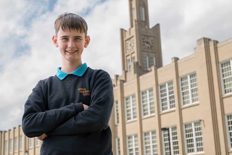 Middle school student outside of school building