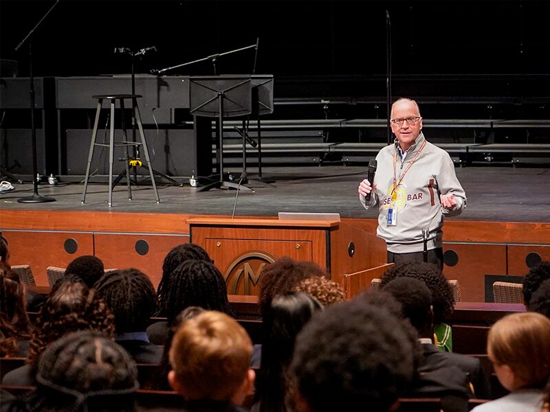 MHS President Pete Gurt '85 speaking at student leadership conference