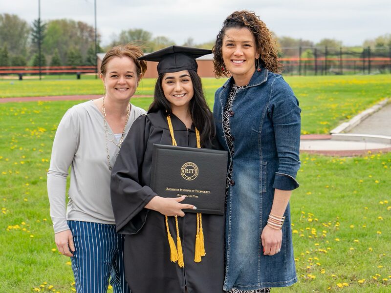 Tatiana Ariola ’15 stands with two mentors from Rochester Institute of Technology.