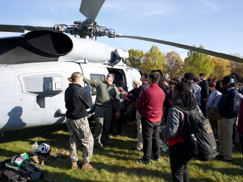 Navy aviators teaching students about careers in the military